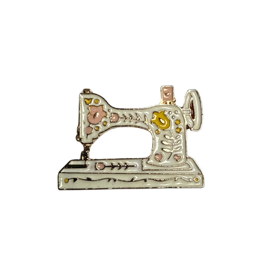 Pin máquina de coser blanca